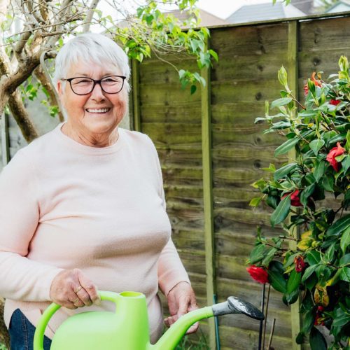 Woman holding watering can