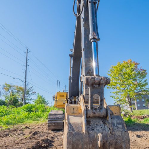 Excavator clears a site to make way for the construction of a new development.