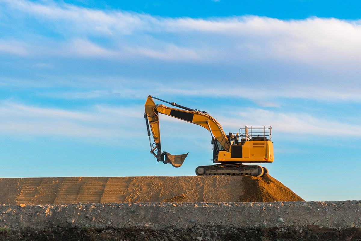 large-yellow-excavator-at-work-road-construction-2022-11-15-14-05-43-utc